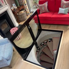 Hinged Glass Cellar Door Over a Spiral Staircase, London Living Room